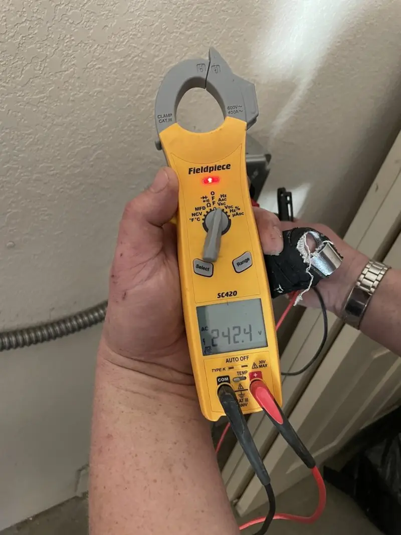 Voltage testing with clamp meter during Generator Installation in Miami Shores